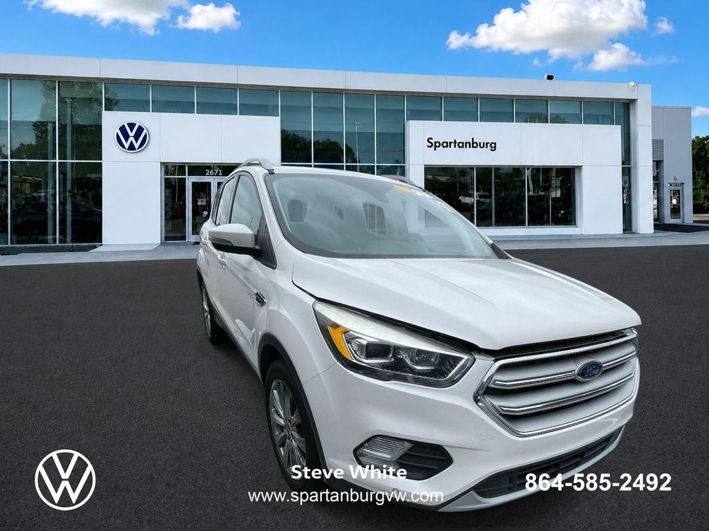2018 Ford Escape Titanium in White Platinum Clearcoat Metallic — front three-quarter view
