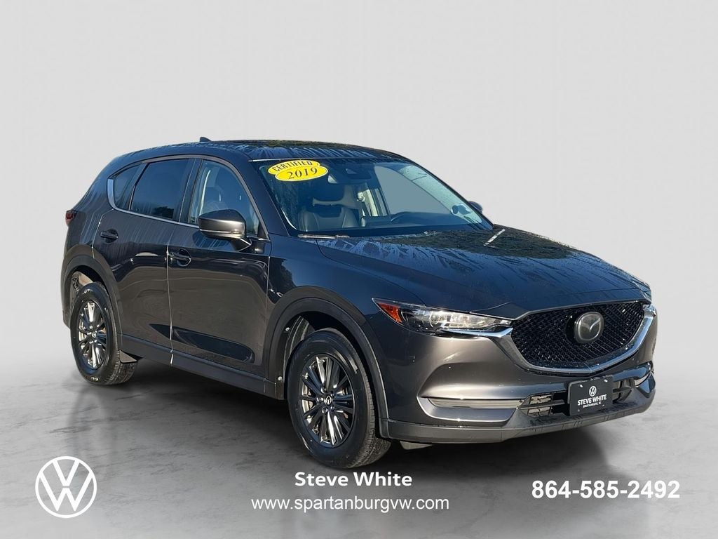 2019 Mazda Mazda CX-5 Touring in Machine Gray Metallic — front three-quarter view